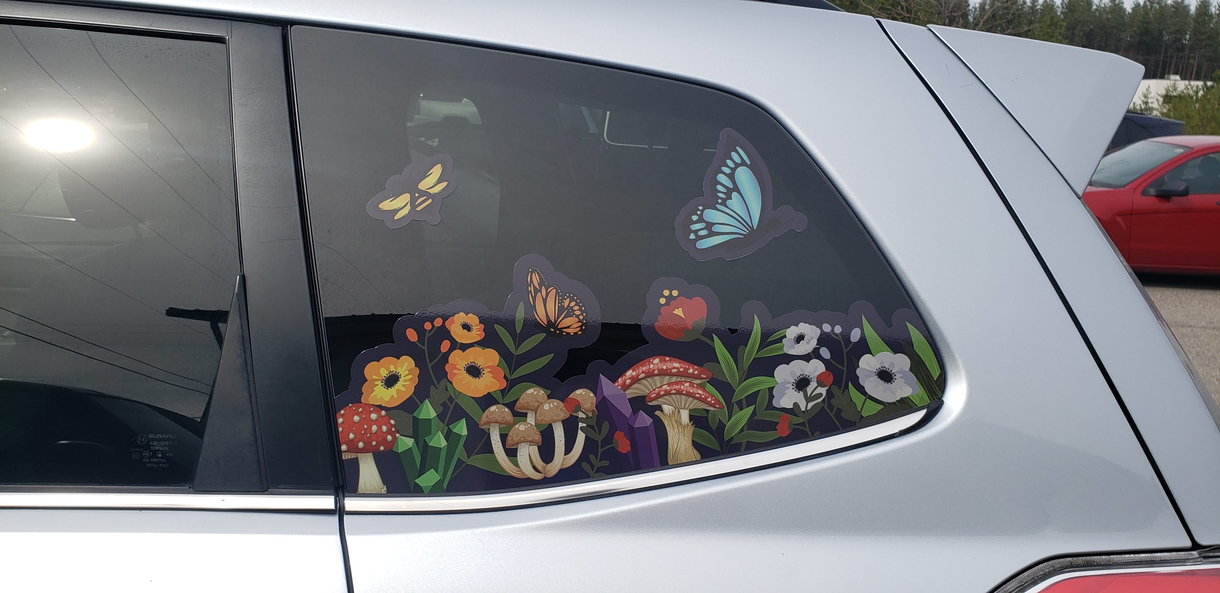 car window sticker design of flowers, mushrooms, and bugs