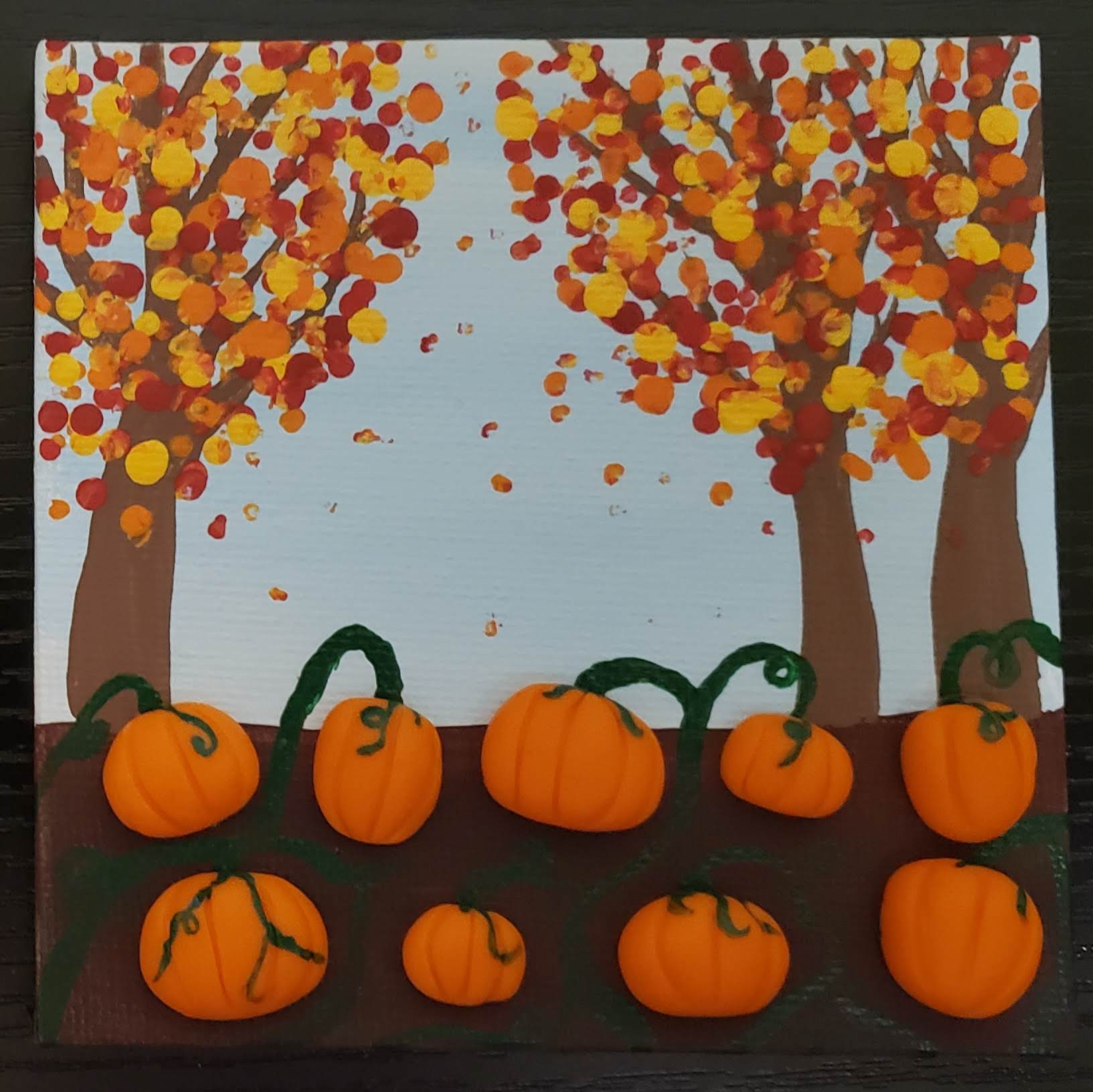 mixed media painting of a fall scene with clay pumpkins